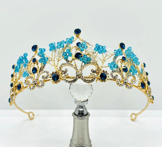 Goldene Tiara mit blauen Strasssteinen 